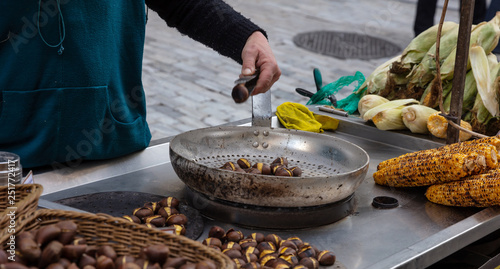 Fototapeta Naklejka Na Ścianę i Meble -  Street food. Grilled sweet corn and chestnuts, Ermou street Athens, Greece.