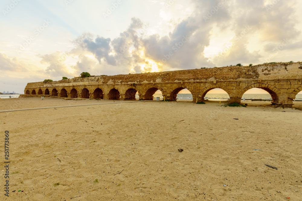 Sunset view of the beach and the Roman Aqueduct in Caesarea