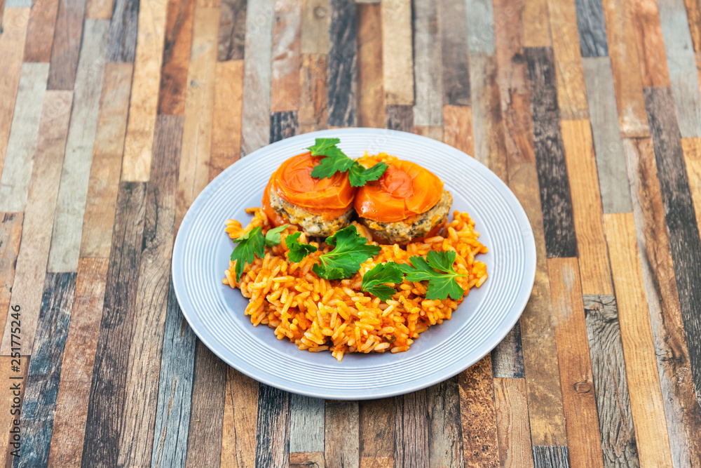 stuffed tomatoes with rice on a white plate stuffed tomatoes with rice on a white plate