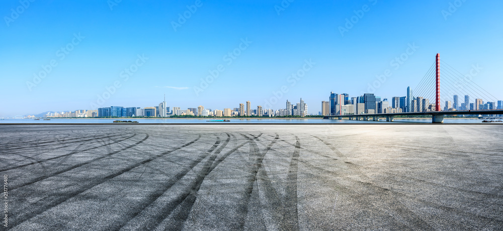 Empty asphalt square ground and city skyline with buildings in Hangzhou Empty asphalt square ground and city skyline with buildings in Hangzhou