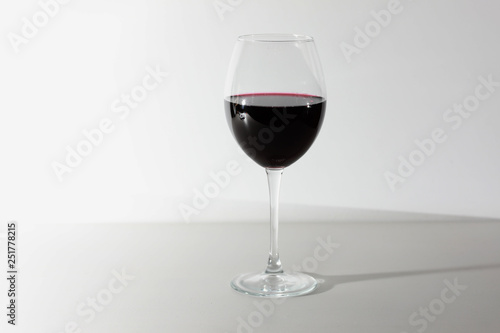 Glass of red wine isolated on white background. A glass of red wine. Copy space. Concept restaurant, alcohol, party.