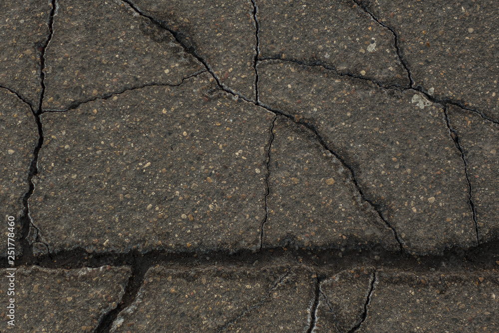 Obraz premium old cracked asphalt close up