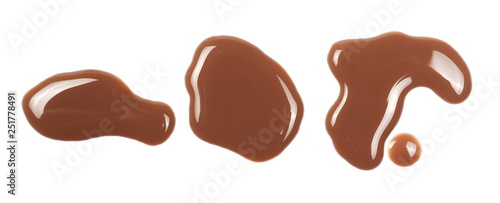 Chocolate milk puddle isolated on white background, top view
