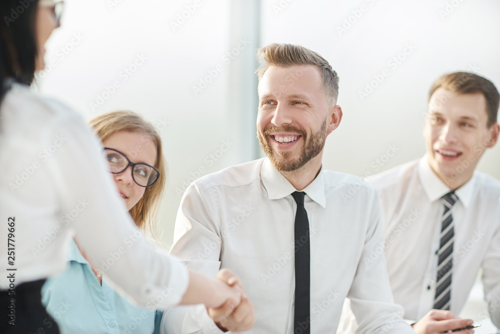 close up.businessman shaking hands with his business partner close up.businessman shaking hands with his business partner