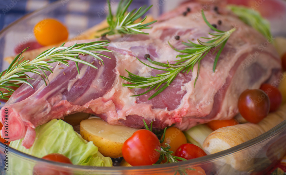 Fresh and raw meat. Leg of lamb on wood background Fresh and raw meat. Leg of lamb on wood background