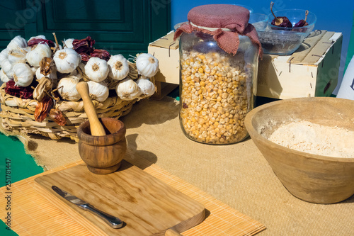 Workshop to prepare Canarian meals such as gofio or mojo picon. Jar with corn, garlic and dried peppers. photo