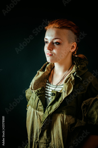 Young woman with red hair in military uniform