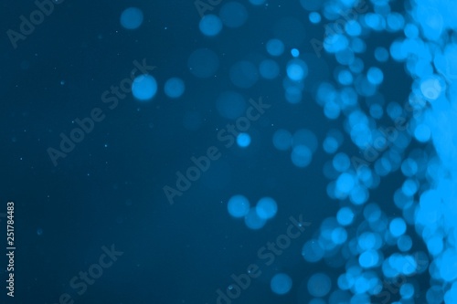 light blue shiny sparkles one side frame bokeh texture - wonderful abstract photo background