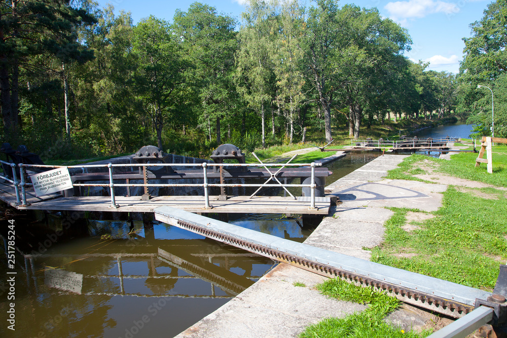 Typical old historic canal lock in Hjalmaren canal, Arboga, Sweden