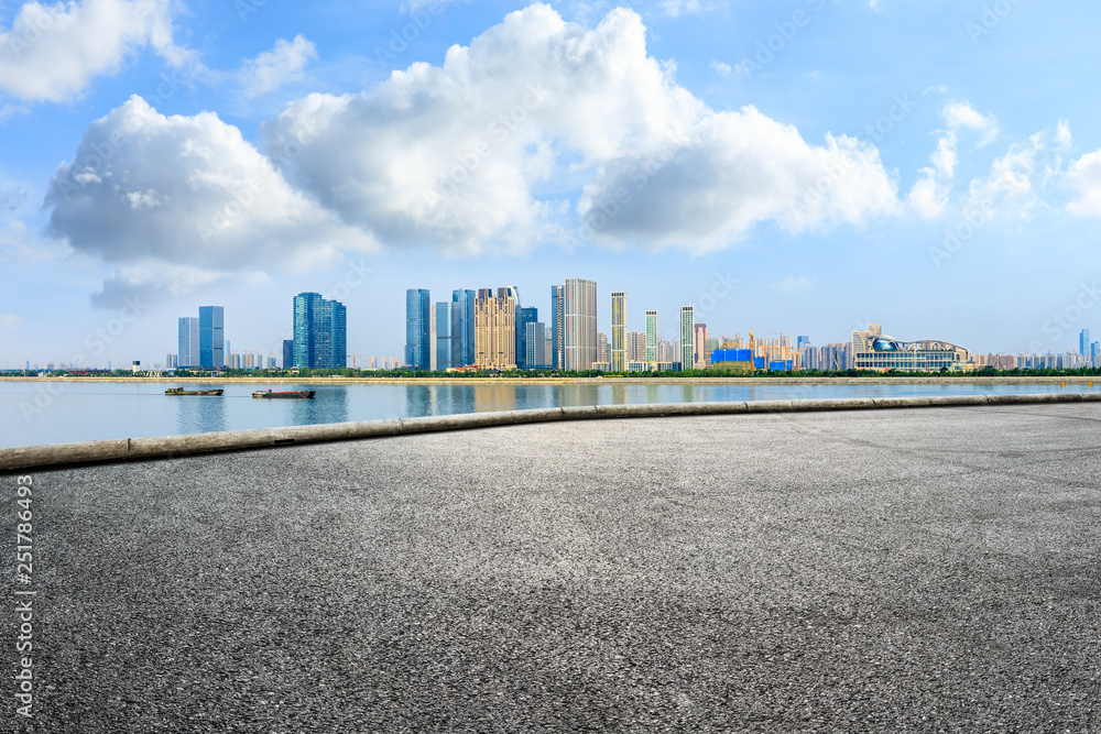 Empty asphalt road and modern city skyline with buildings in Hangzhou Empty asphalt road and modern city skyline with buildings in Hangzhou