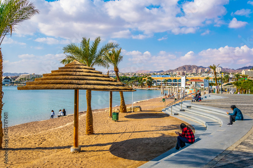 EILAT, ISRAEL, DECEMBER 30, 2018: People are enjoying a sunny day on a beach in Eilat, Israel