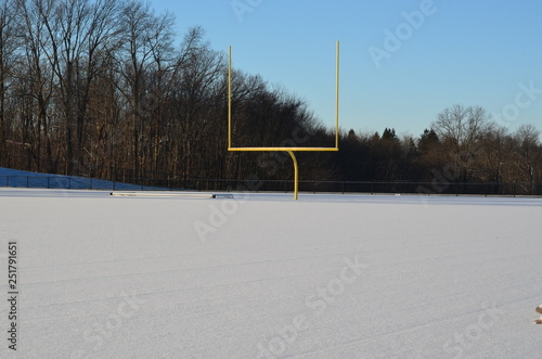 Football field covered in winter snow