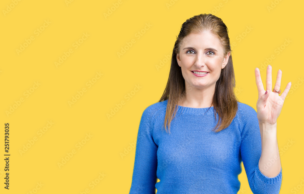 Beautiful middle age mature woman wearing winter sweater over isolated background showing and pointing up with fingers number four while smiling confident and happy. Beautiful middle age mature woman wearing winter sweater over isolated background showing and pointing up with fingers number four while smiling confident and happy.