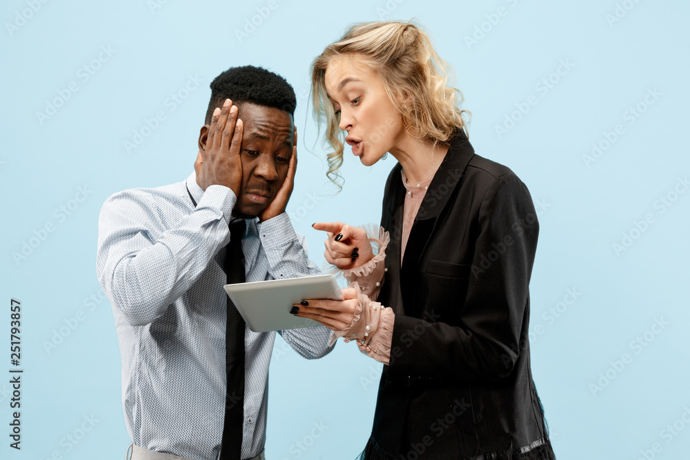 Serious boss. Woman and her secretary standing at office or studio. Businesswoman and her colleague. Office relationships concept, Human emotions Serious boss. Woman and her secretary standing at office or studio. Businesswoman and her colleague. Office relationships concept, Human emotions