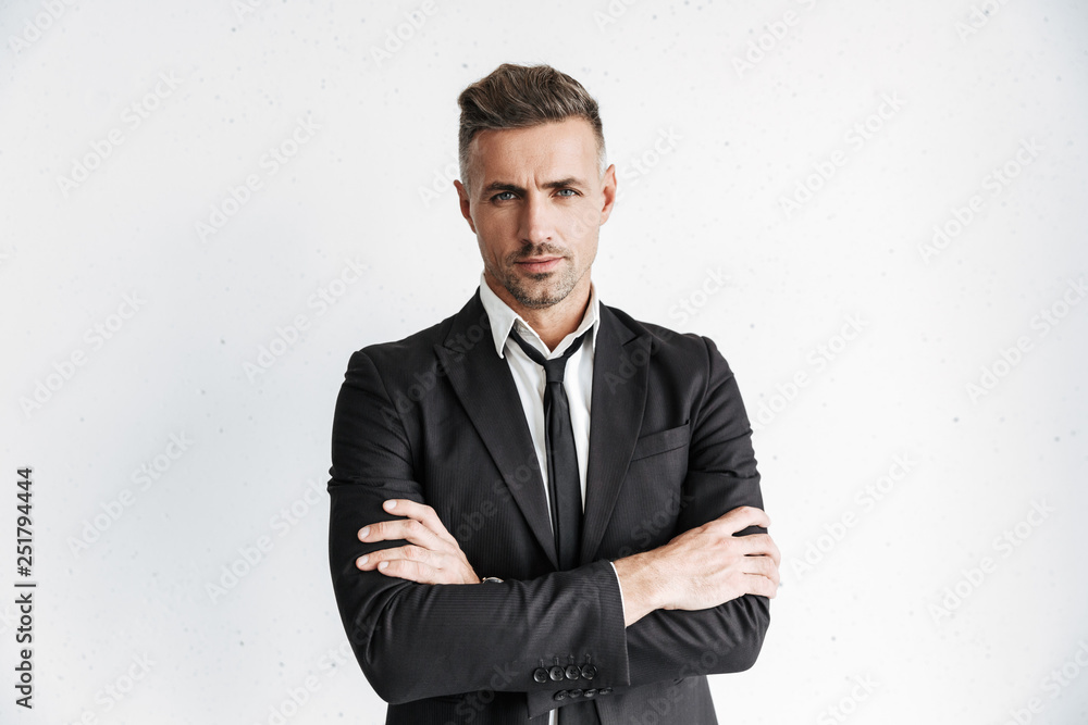 Handsome business man posing isolated over white wall background. Handsome business man posing isolated over white wall background.