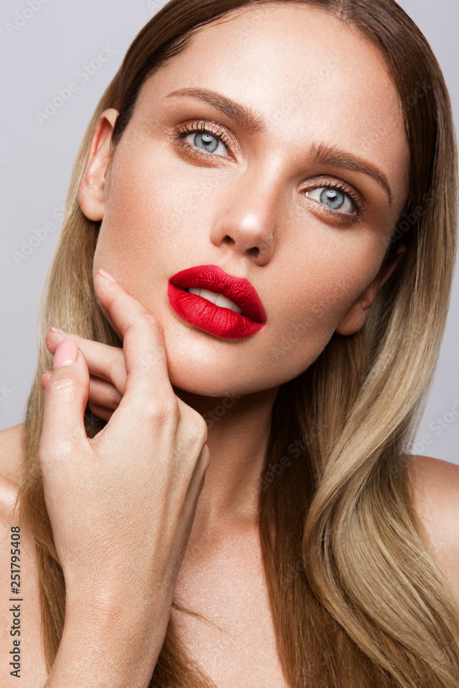 Beautiful young model with red lips isoleted on a wight background Beautiful young model with red lips isoleted on a wight background