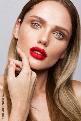 Beautiful young model with red lips isoleted on a wight background