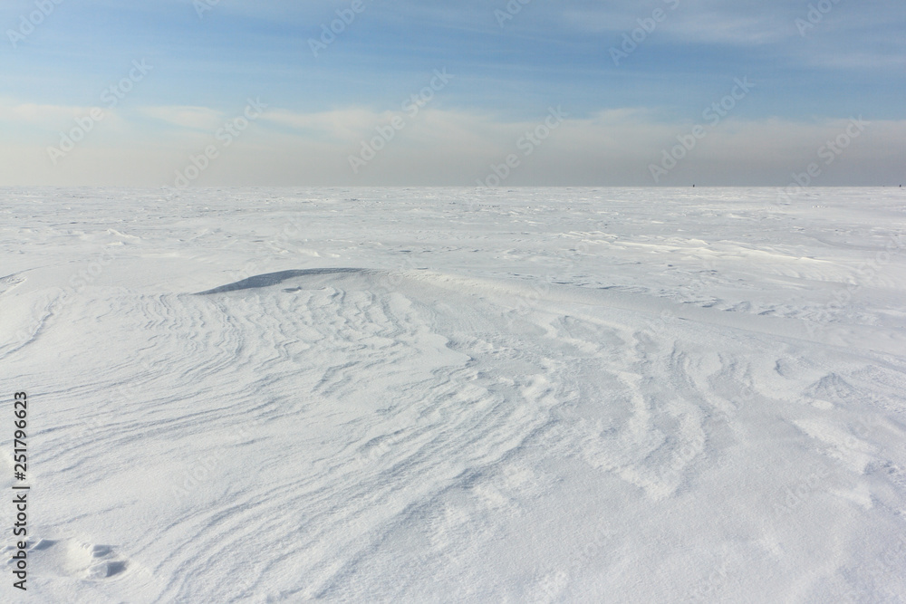 Snow  on a frozen river in winter, Obskoe Reservoir, Novosibirsk, Russia