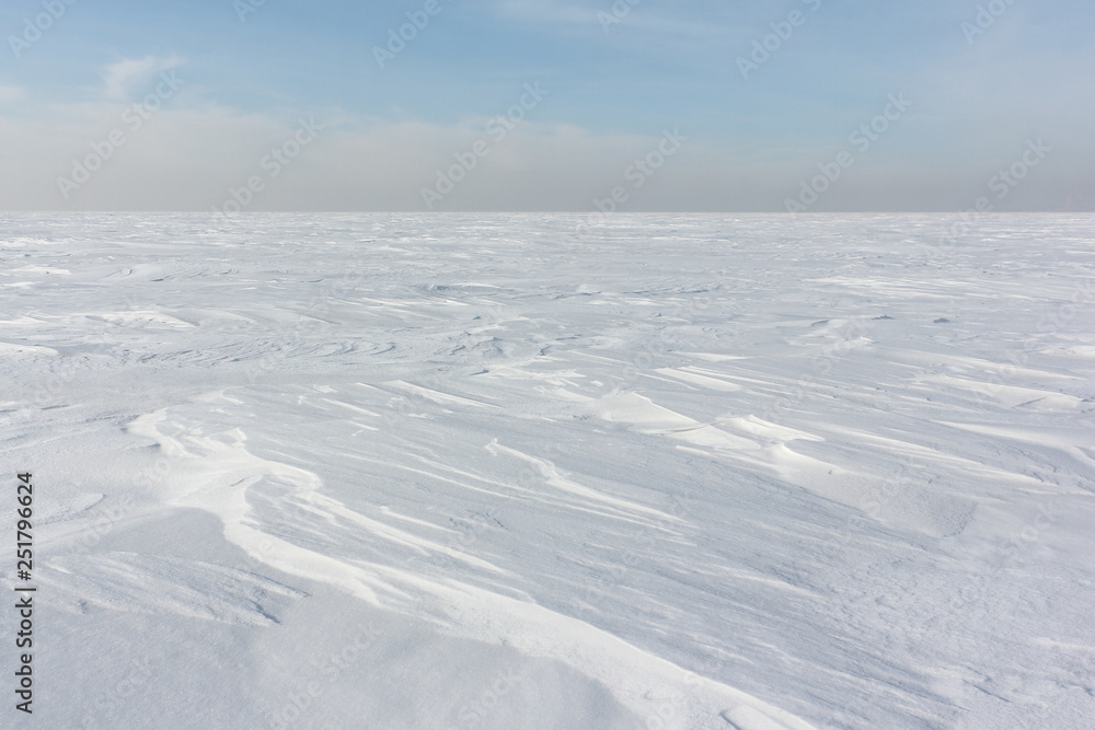 Snow  on a frozen river in winter, Ob Reservoir, Novosibirsk, Russia