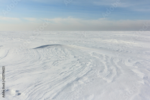 Snow on a frozen river in winter, Obskoe Reservoir, Novosibirsk, Russia