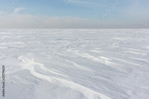 Snow  on a frozen river in winter, Ob Reservoir, Novosibirsk, Russia © Nataliia Makarova