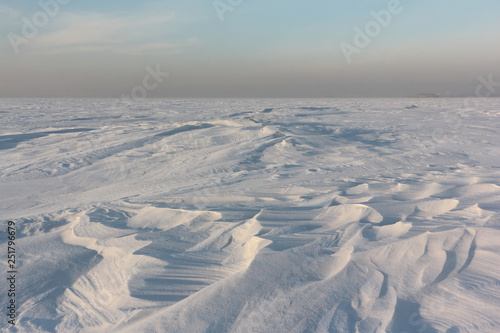 Snow on a frozen river in winter, Ob Reservoir, Novosibirsk, Russia