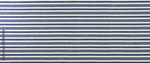 Blue and white striped classic fabric closeup, clean background.