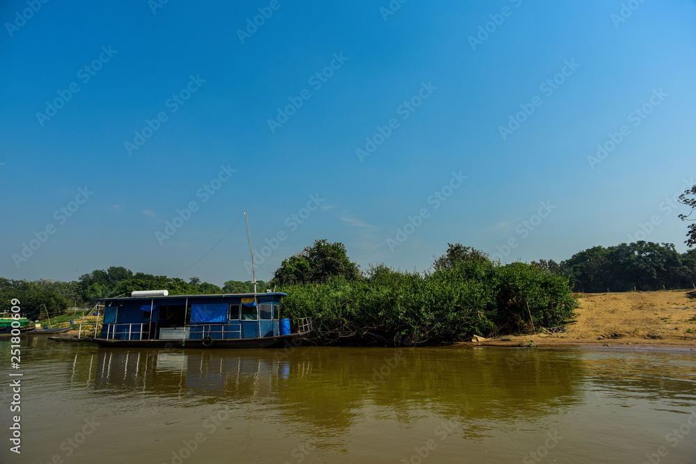 River landscape,home boat  and jungle,Pantanal, Brazil