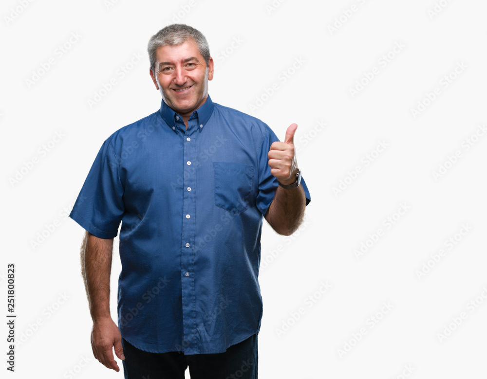 Handsome senior man over isolated background doing happy thumbs up gesture with hand. Approving expression looking at the camera with showing success. Handsome senior man over isolated background doing happy thumbs up gesture with hand. Approving expression looking at the camera with showing success.