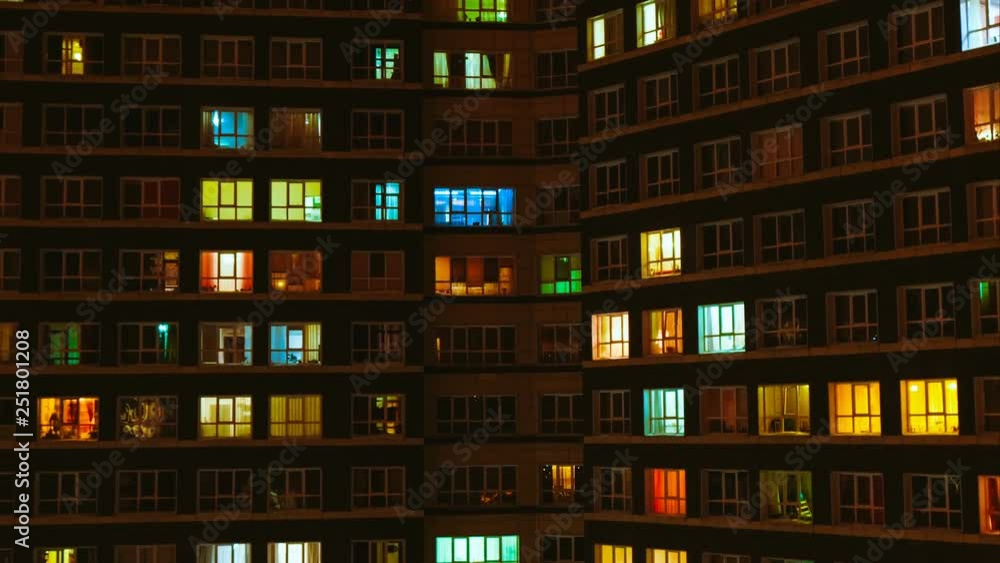 Light in the windows of a multistory building. Time lapse Light in the windows of a multistory building. Time lapse