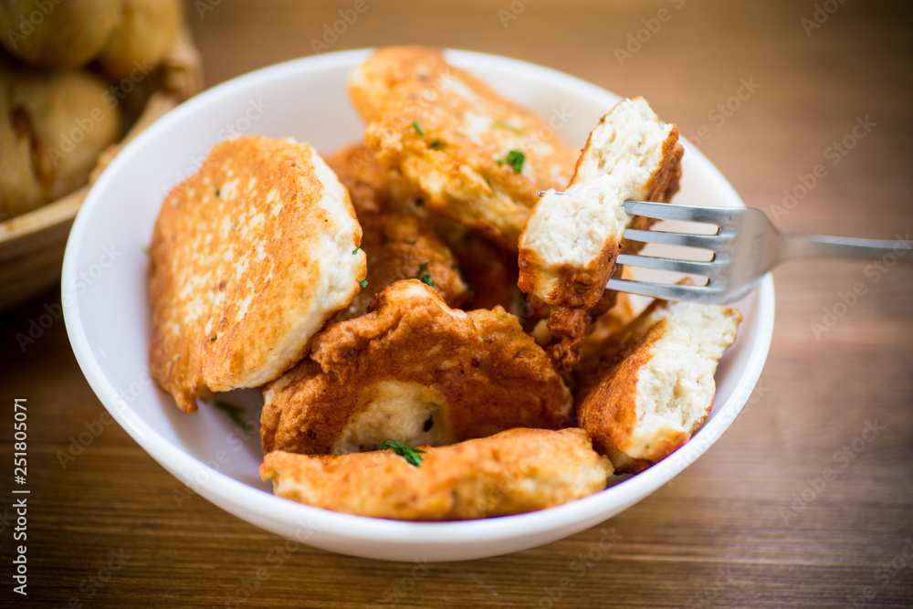 fried chicken cutlets in a white bowl fried chicken cutlets in a white bowl