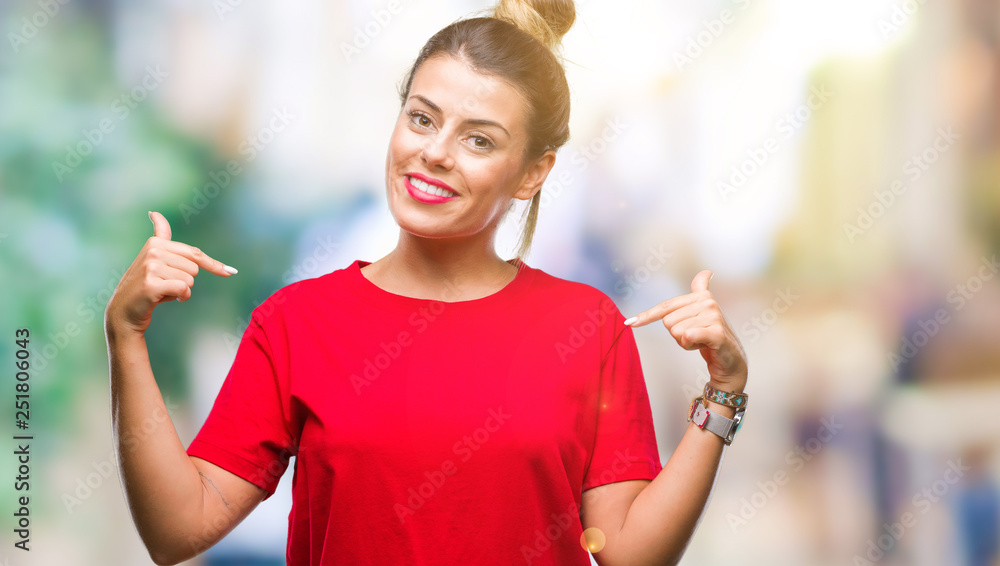 Young beautiful woman over isolated background looking confident with smile on face, pointing oneself with fingers proud and happy.