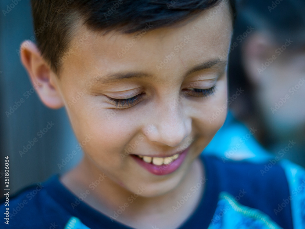 Beautiful boy teens with dark hair smiling close up portrait. Beautiful boy teens with dark hair smiling close up portrait.