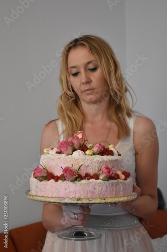 Portrait of the young woman with the cake