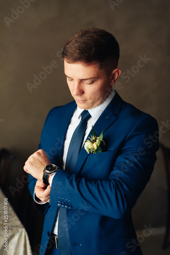 the groom in a wedding suit, a man preparing for the wedding 1
