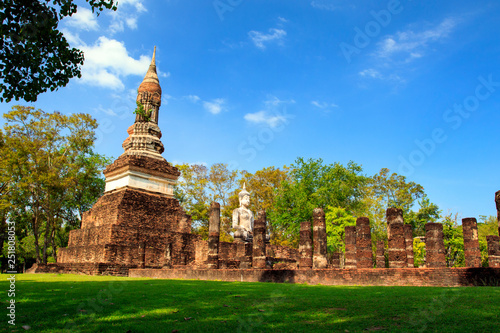 Pagoda and the buddha statue. in Old Buddhist temple in Sukhothai historical park In Thailand., Tourism, World Heritage Site, Civilization,UNESCO.