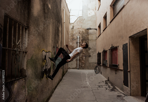 young sportsman practicing parkour.