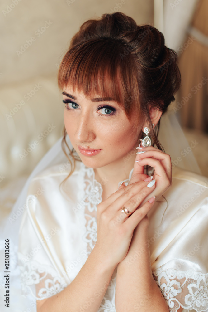 morning of the bride, a beautiful woman in a white dress is preparing for the wedding 1