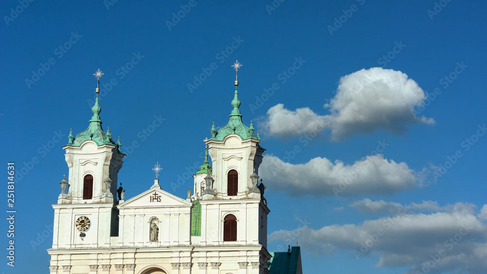 Fototapeta premium Grodno. Belarus. The domes of the Church of St. Xavier on the background of blue sky with white clouds.