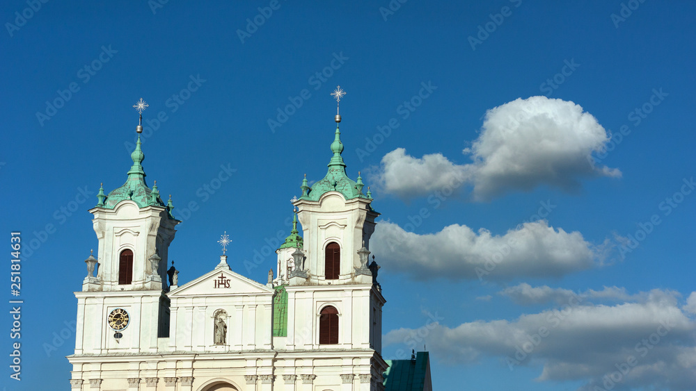 Grodno. Belarus. The domes of the Church of St. Xavier on the background of blue sky with white clouds.