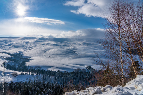 Wonderful winter mountain landscape: forest and snow-covered alpine meadows in winter Lago-Naki, The Main Caucasian Ridge, Russia