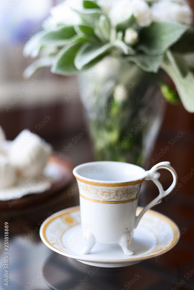 morning coffee with an airy white marshmallow dessert a bunch of fresh flowers on the table morning coffee with an airy white marshmallow dessert a bunch of fresh flowers on the table