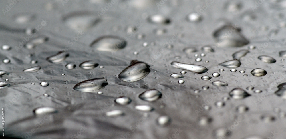 Unusual monochrome background of mercury or water drops