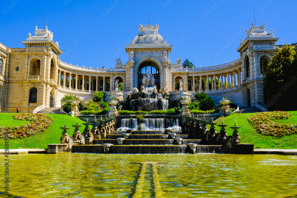 Marseille. Palais de Longchamp with fountains and sculptures in sunny day.