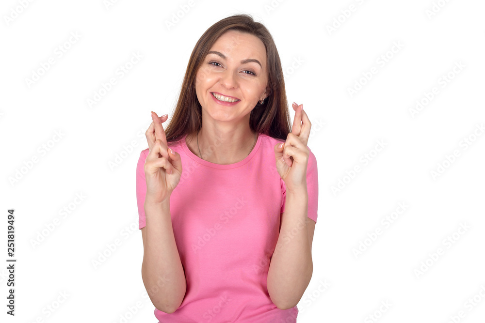 Young girl crossed her fingers for good luck. Portrait of a happy brunette woman with long hair on a white background. Young girl crossed her fingers for good luck. Portrait of a happy brunette woman with long hair on a white background.
