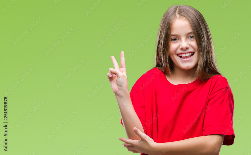 Young beautiful girl over isolated background smiling with happy face winking at the camera doing victory sign. Number two. Young beautiful girl over isolated background smiling with happy face winking at the camera doing victory sign. Number two.