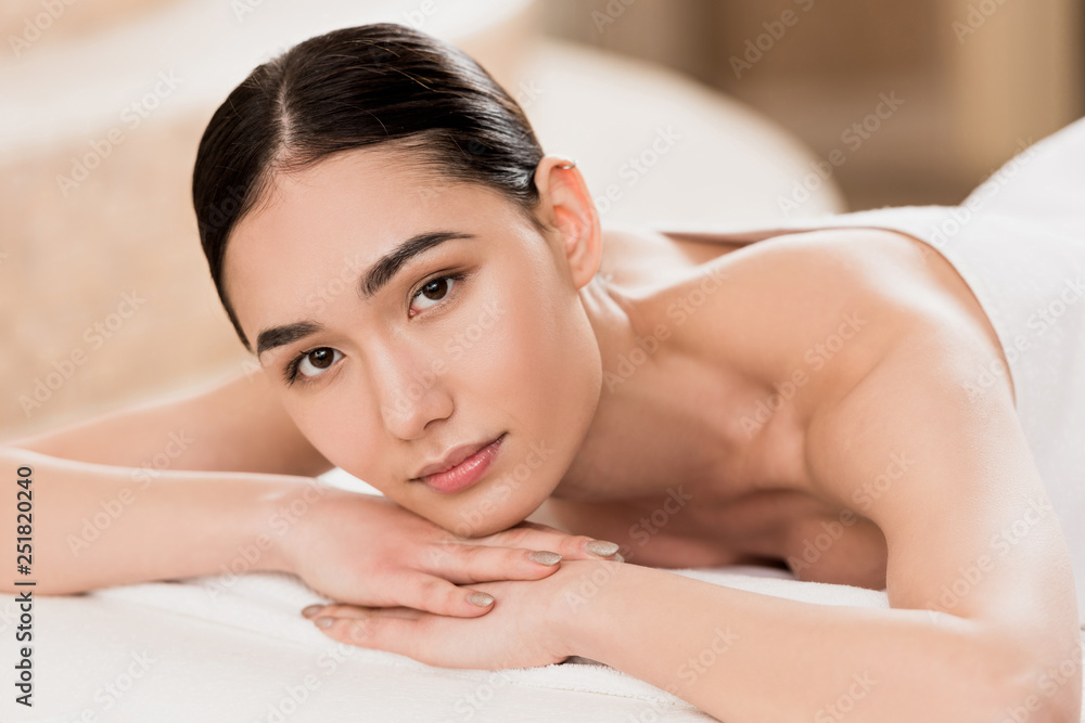 beautiful asian woman resting and looking at camera at spa beautiful asian woman resting and looking at camera at spa