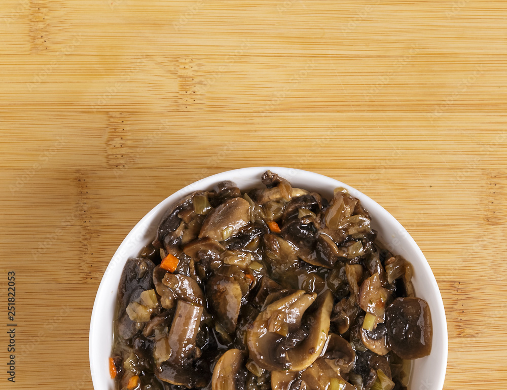 Fried mushrooms in a plate on the table. Fried mushrooms in a plate on the table.