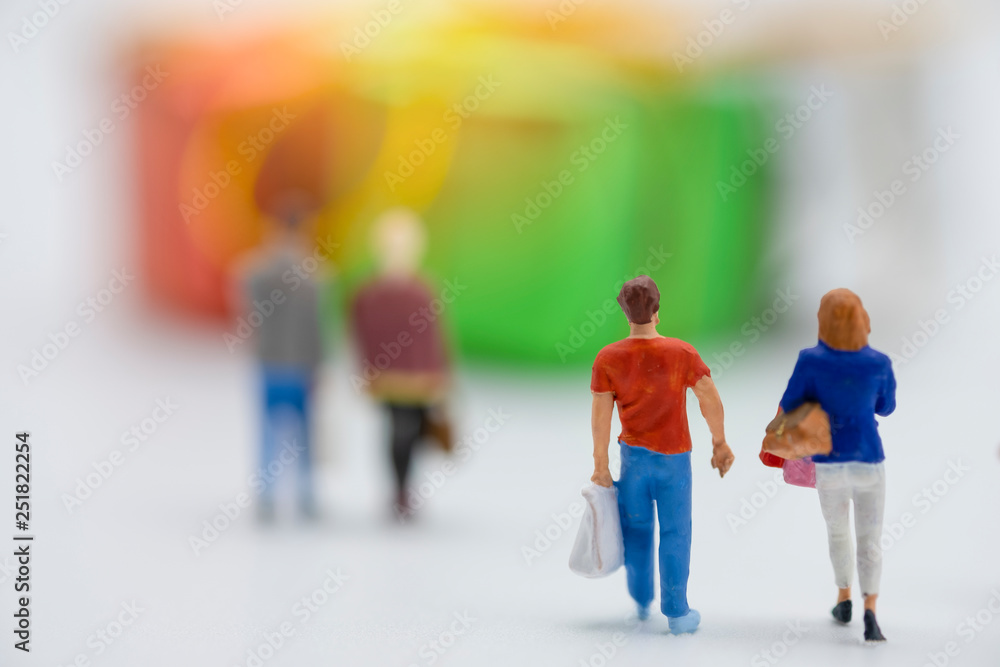 Miniature people buy goods or merchandise during grand sale and discount using as shopping business concept. - Image Miniature people buy goods or merchandise during grand sale and discount using as shopping business concept. - Image