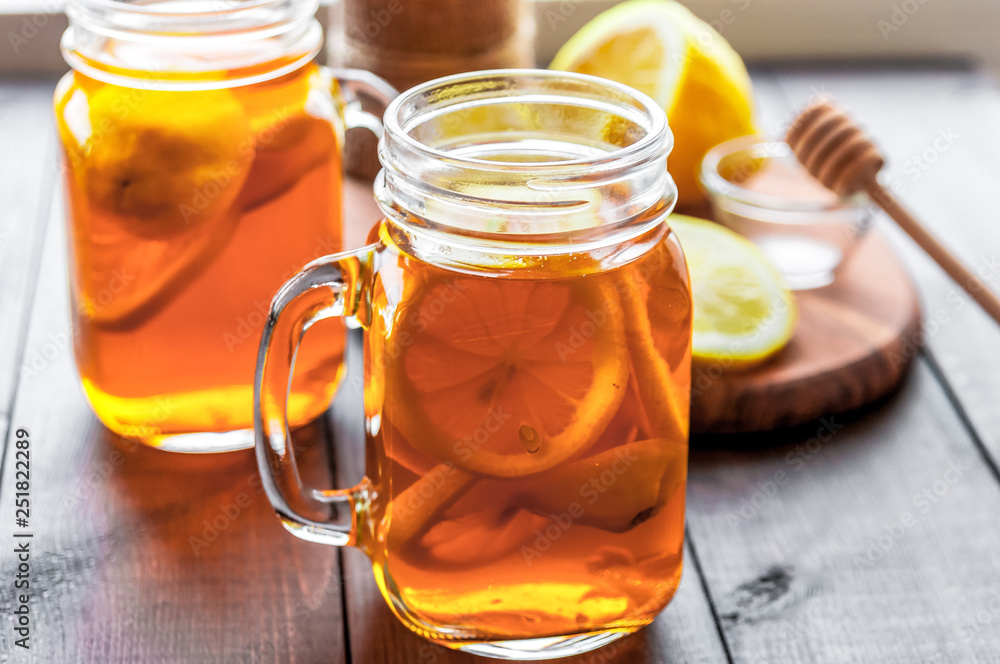 Hot tea with lemon and natural honey, good treat to have vitamins and strong immunity. Hot tea with lemon and natural honey, good treat to have vitamins and strong immunity.